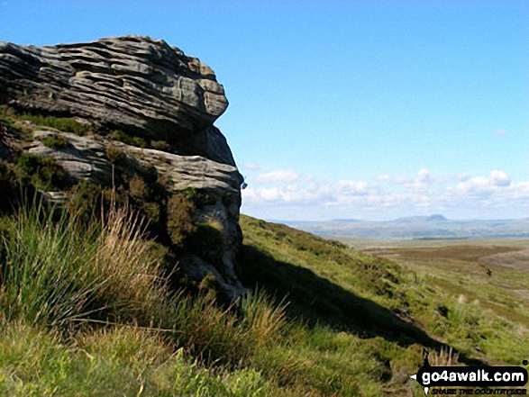 Rock formations at Knottend Well with Whernside on the horizon 