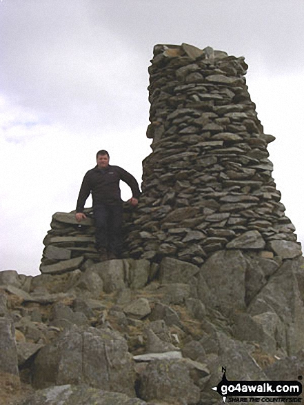 Me at the massive cairn on Thornthwaite Crag in The Lake District Cumbria England