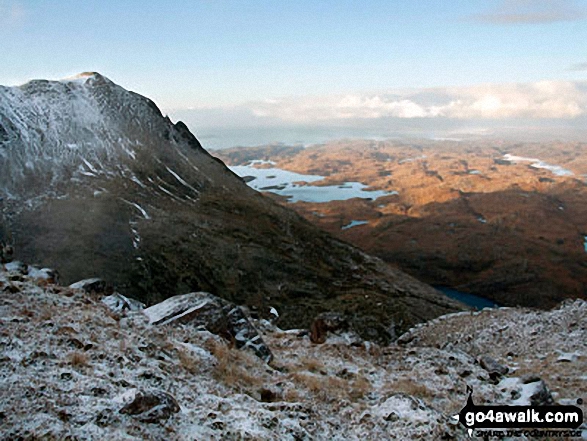 Snow on Bod a' Mhadail with Loch Sionascaig in the distance from the summit of Cul Mor 