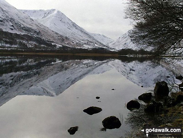 Walk c138 Brothers Water from Patterdale - The lower slopes of Hartsop Dodd (left), Caudale Head, The Kirkstone Pass and High Hartsop Dodd (right, behind the tree) reflected in Brothers Water in the snow