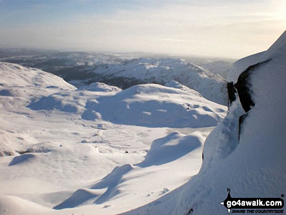 Looking down a very snowy Stickle Ghyll to Great Langdale with Lingmoor Fell beyond from Stickle Tarn