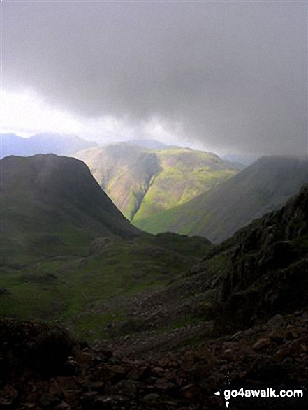 Walk c370 Scafell Pike from Seathwaite - Lingmell (left) and Kirk Fell in sunlight from near Dropping Crag below Scafell Pike