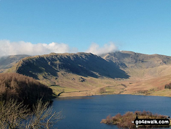 The Rigg (bottom left), Rough Crag (Riggindale) and High Street with a touch of snow on it across Haweswater Reservoir from near Rowantreethwaite Beck on Mardale Banks