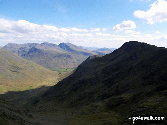 Walk c101 Pillar and Little Scoat Fell from Wasdale Head, Wast Water - Looking down Mosedale to Wasdale Head from Little Scoat Fell with Red Pike (Wasdale) on the right in shadow and the Scafell Massif (featuring Great End, Broad Crag, Lingmell, Scafell Pike, Symonds Knott and Sca Fell) across the valley