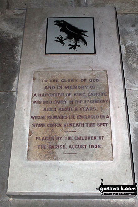 Tomb inside Bosham Church The inscription reads: 'TO THE GLORY OF GOD AND IN MEMORY OF A DAUGHTER OF KING CANUTE WHO DIED EARLY IN THE 11TH CENTURY AGED ABOUT 8 YEARS WHOSE REMAINS LIE ENCLOSED IN A STONE COFFIN BENEATH THIS SPOT<br>PLACED BY THE CHILDREN OF THE PARISH AUGUST 1906'