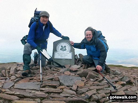 Mick and Rob, friends of 40 years make it to the top of a windswept Pen Y Fan Photographed by Steve