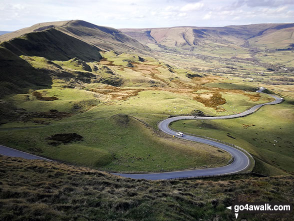 Walk d123 Mam Tor via Cavedale from Castleton - The road winding its way down to Edale from Mam Tor with Lord's Seat (Rushup Edge) (left) and Kinder Scout in the distance