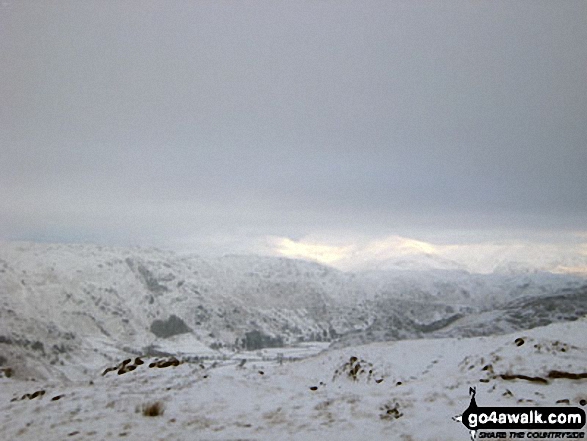 Great Langdale and Blea Rigg with The Helvellyn Massiff in the distance under a deep blanket of snow from the lower slopes of Pike of Blisco (Pike o' Blisco) 