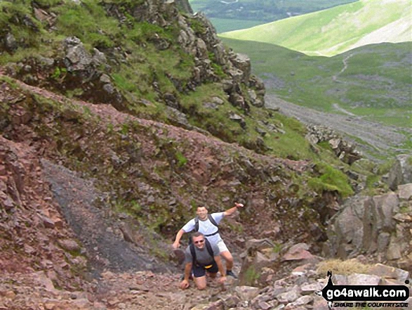 40 year old peak baggers on Scafell Pike in The Lake District Cumbria England