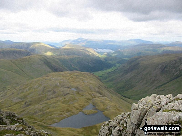 Walk c194 Scafell Pike from The Old Dungeon Ghyll, Great Langdale - Skiddaw and Derwent Water (in distance) with Seathwaite Fell and Sprinkling Tarn (foreground) from Great End (Scafell Massif)