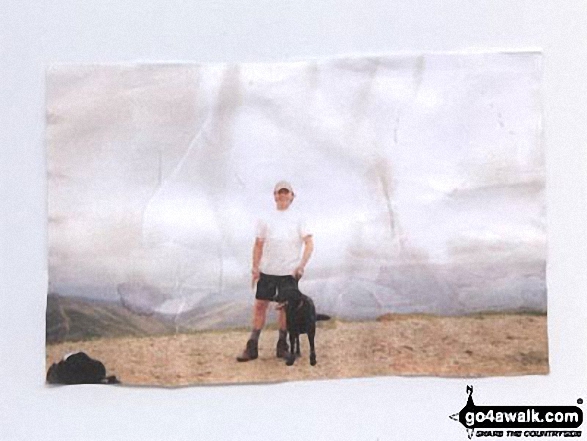 My friend Ian and his dog Max on Helvellyn in The Lake District Cumbria England