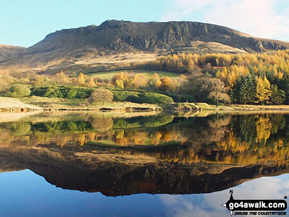 Dove Stone Rocks mirrored in a perfectly calm Dove Stone Reservoir near Greenfield 