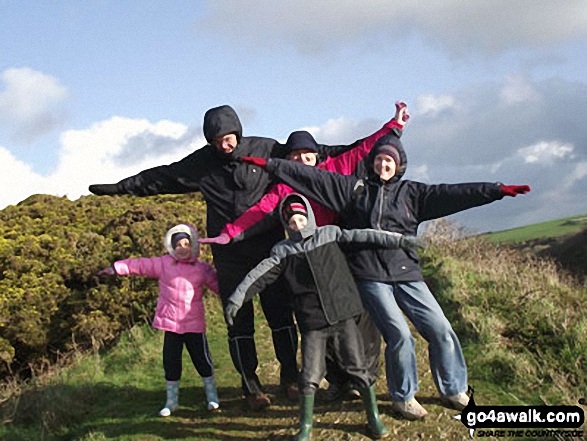 My wife, two children, aunt and uncle on top of a large hill overlooking Solva Harbour 