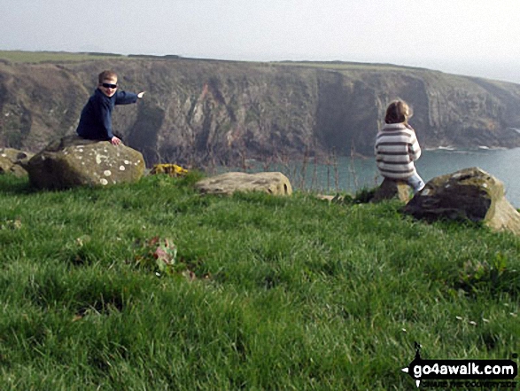 My son and Daughter on a hill overlooking the Pembrokeshire Coastline near Solva Harbour 