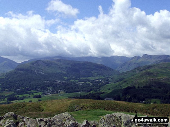 Walk c274 Loughrigg Fell from Elterwater - On the summit of Loughrigg Fell, looking towards Elterwater with the Langdale Pikes to the right