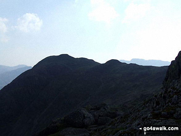 Walk c208 Harrison Stickle and High Raise from The New Dungeon Ghyll, Great Langdale - Harrison Stickle in silhouette from Pavey Ark (Langdale Pikes)