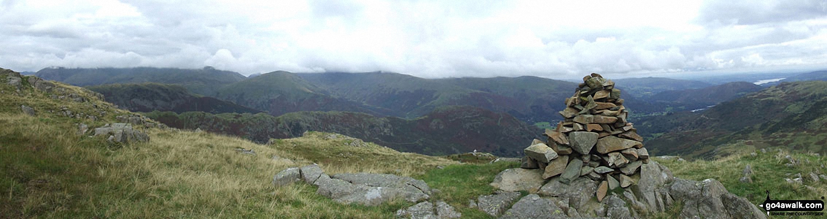 Steel Fell, Gibson Knott and Helm Crag below Seat Sandal (with Helvellyn and Fairfield in mist beyond) from Tarn Crag summit cairn