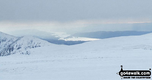 Walk c272 High Street and Angletarn Pikes from Brothers Water - A distant Lake Windermere from the summit of High Street in the snow