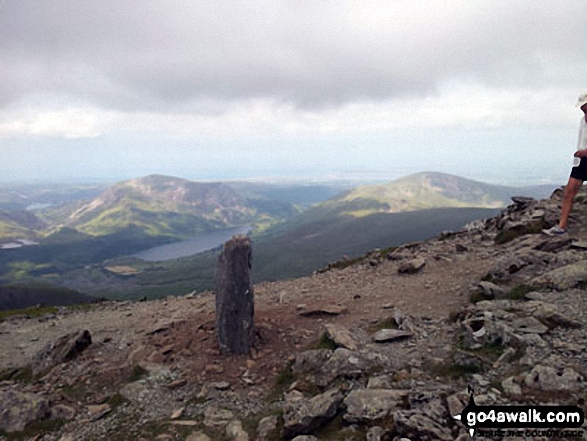 Walk gw136 The Snowdon (Yr Wyddfa) Horseshoe from Pen y Pass - Post marking the pint where the Watkin Path joins Snowdon (Yr Wyddfa)'s South ridge above Bwlch Main - with Mynydd Mawrm Llyn Cwellyn and Moel Eilio in the distance