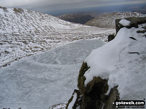 A Frozen Red Tarn from Striding Edge in the Snow