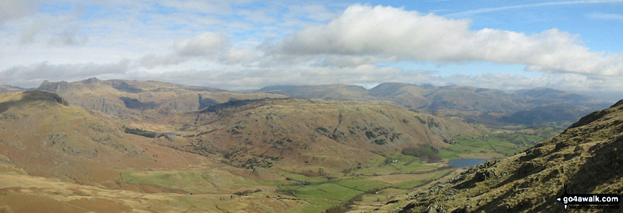 *Little Langdale with the Langdale Pikes, Helvellyn and Fairfield beyond from 
        Wetherlam