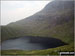 Bow Fell (Bowfell) (North Top) towering above Angle Tarn (Langdale)