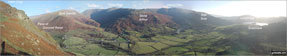 Helm Crag, Seat Sandal,  Grisedale Hause, Fairfield, Great Rigg, Stone Arthur, Heron Crag, Nab Scar, Loughrigg and Grasmere above The Pass of Dunmail Raise from the top of High Raven Crag