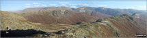 The Helvellyn Ridge featuring: Great Dodd, Watson's Dodd, Stybarrow Dodd, Raise (Helvellyn), White Side, Helvellyn, Nethermost Pike, Dollywaggon Pike, St Sunday Crag, Fairfield, Great Rigg and Heron Pike with Steel Fell (mid distance) and Calf Crag, Gibson Knott and Helm Crag  (foreground) from Brownrigg Moss
