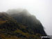 A misty Blea Crag on the descent down from Blea Rigg