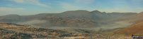 The Westerly aspect from Hollow Moor includes a distant view of Crinkle Crags with Yoke, Ill Bell, Froswick and Thornthwaite Crag above Kentmere