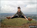 Me jumping for joy at the great view from at Arthur's Seat, Edinburgh, with Edinburgh Castle in the background