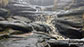 Cascading water on a misty Kinder Scout