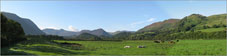 The view is across the Vale of Lorton towards Whiteside (left), High Stile and Red Pike (Buttermere), Mellbreck (centre) and Fellbarrow and Low Fell (right)