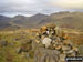 Hard Knott summit cairn - with Esk Pike, Bow Fell (Bowfell) and Crinkle Crags gracing the skyline