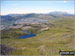 Llyn Du-bach & Maen-offeren Quarry (foreground) with Allt-fawr, Moel Druman, Ysgafel Wen in the distance and Yr Aran, Mount Snowdon (Yr Wyddfa) and Y Lliwedd on the horizon from the summit of Manod Mawr (North Top)