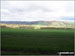 The Eildon Hills and Wellington's Pillar from The St Cuthbert's Way near Chestercleuch Plantation