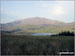 The Snowdon Massif - Garnedd Ugain (Crib y Ddysgl), Snowdon (Yr Wyddfa) & Y Lliwedd  beyond Llyn-y-Gader from Cwm Marchnad at the northern edge of Beddgelert Forest