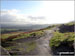 Walking towards Mam Tor on land slipped road