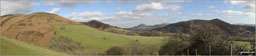 Callow (left), Nills, Church Stretton, The Lawley, Caer Caradoc Hill and Ragleth Hill (right) from near Minton