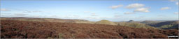 The Long Mynd (Pole Bank), Yearlet and Ashlet (mid-distance) with The Lawley (left), Caer Caradoc Hill, Church Stretton, Ragleth Hill (right) beyond from near Grindle above Ashes Hollow