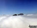 The summits of Ben Vane (left) and Beinn Ime poking up through the clouds during a temperature inversion seen from Ben Vorlich (The Arrochar Alps)