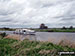 Pleasure craft on the River Bure with St Benet's Abbey Drainage Mill beyond