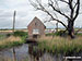 Hut at the path junction on South Walsham Marshes with the River Bure beyond