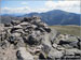 Y Garn (Glyderau) summit cairn with Crib Goch and Garnedd Ugain in the distance