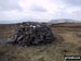 Fountains Fell summit cairn with Pen-y-ghent in the background