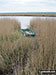 Boat in the reeds on the banks of the River Yare