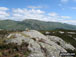 Armboth Fell summit with The Helvellyn massif beyond