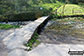 The stone footbridge over the River Bradford near Youlgreave in beautiful Bradford Dale