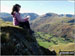 My daughter taking in the wise words of Wainwright on Angletarn Pikes