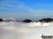 The Glyderau (Glyderau) (left), Tryfan and Carrnedd Dafydd (The Carneddau) poking through low cloud from the summit of Carnedd Moel Siabod